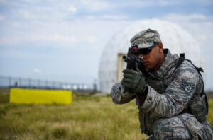 460th Security Forces Squadron defender conducts tactical movements during a field exercise in preparation for the Defenders Challenge July 27, 2018, on Buckley Air Force Base, Colorado. Select Air Force Space Command defenders will compete against one another at Peterson Air Force Base, Colorado, and then winners will compete at Camp Bullis, Texas, for the final challenge. (U.S. Air Force photo by Airman 1st Class Michael D. Mathews.)