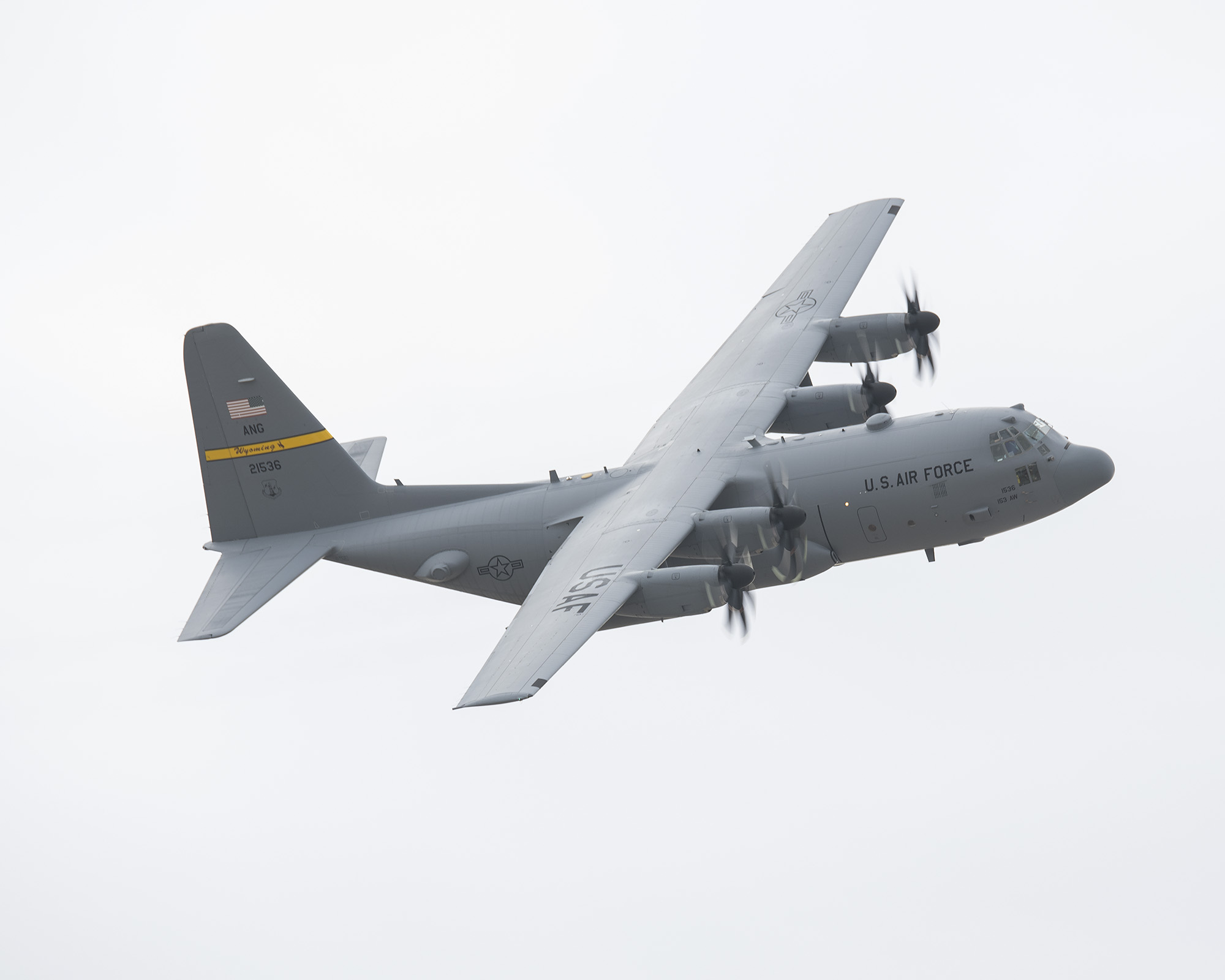 A one of a kind C-130H Hercules aircraft assigned to the Wyoming Air National Guard is seen flying, Jan. 6, 2018 at Cheyenne Regional Airport. The aircraft is the first of the legacy H-model C-130 fleet to be modified with upgraded T-56 Rolls Royce 3.5 engines, NP2000 eight-bladed propellers and electronic propeller controls. (U.S. Air National Guard photo by Senior Master Sgt. Charles Delano.)