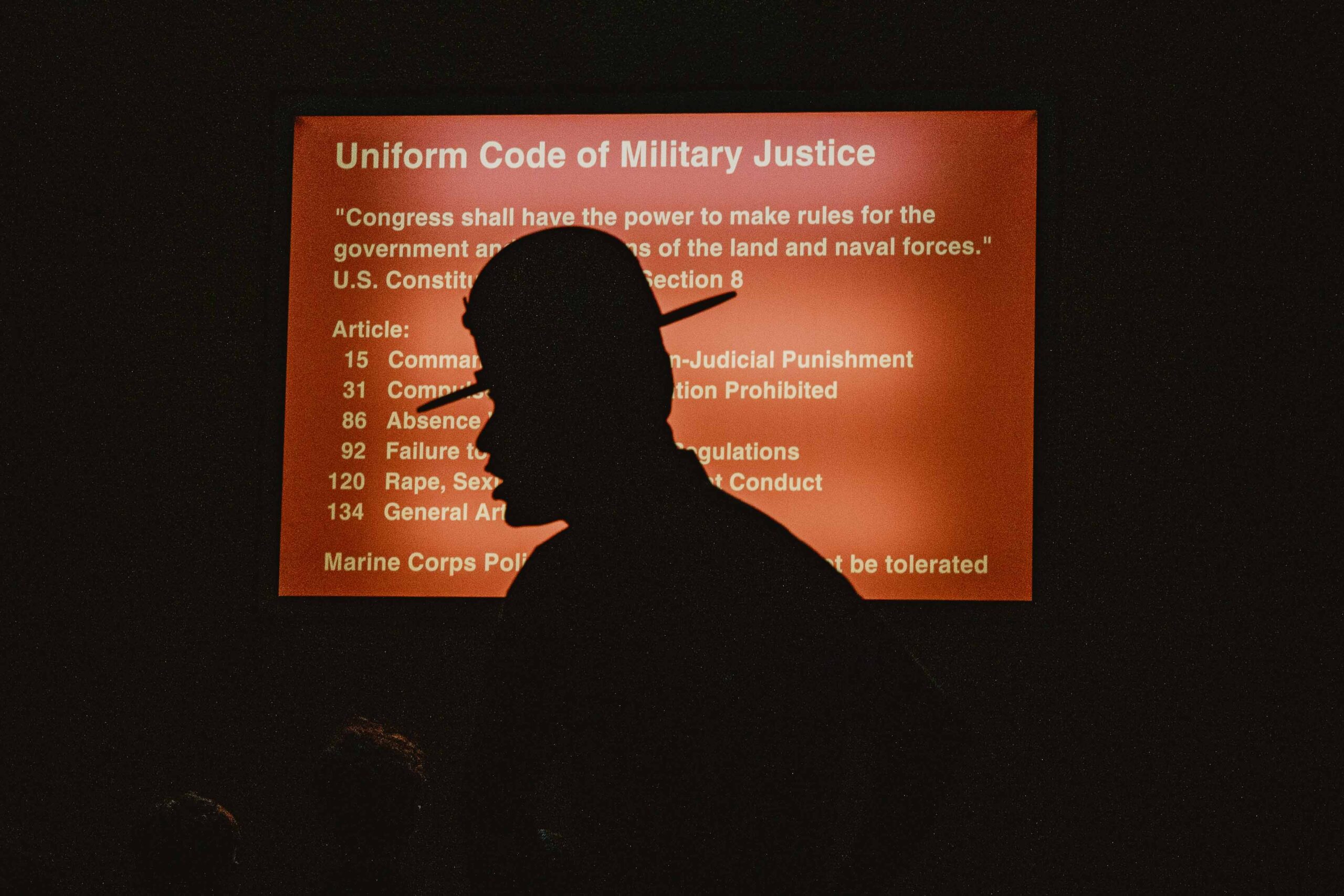 A U.S. Marine Corps drill instructor with Receiving Company, Support Battalion, briefs recruits with Bravo Company, 1st Recruit Training Battalion, as part of a receiving event at Marine Corps Recruit Depot San Diego, California, Oct. 28, 2024. During the receiving process, recruits are taken to the United States Organizations for accountability, checked for contraband, given haircuts, make scripted phone calls home, and issued gear required for training. (U.S. Marine Corps photo by Cpl. Sarah M. Grawcock.)