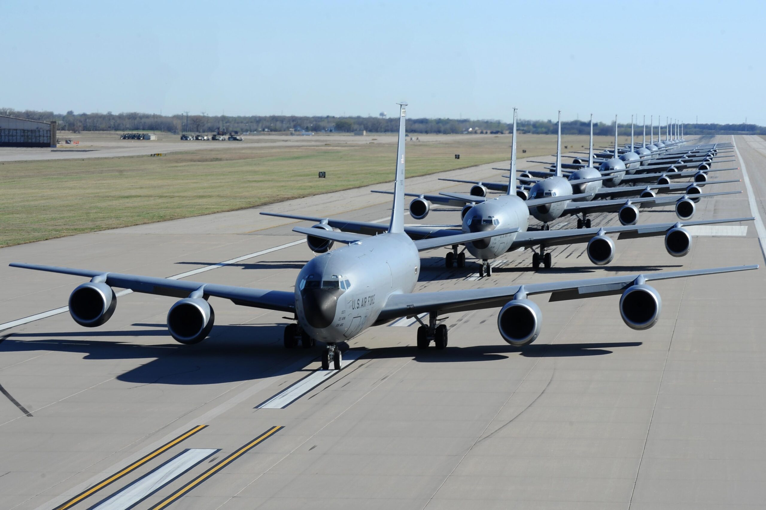 Fourteen KC-135 Stratotankers line up during a simulated alert call March 24, 2016, at McConnell Air Force Base, Kan. Known as the “elephant walk,” the alert call was part of an exercise, which displayed the rapid mobility capabilities and teamwork of the men and women at McConnell AFB to take flight within minutes of being notified of a mission. (U.S. Air Force photos/Airman 1st Class Christopher Thornbury.)