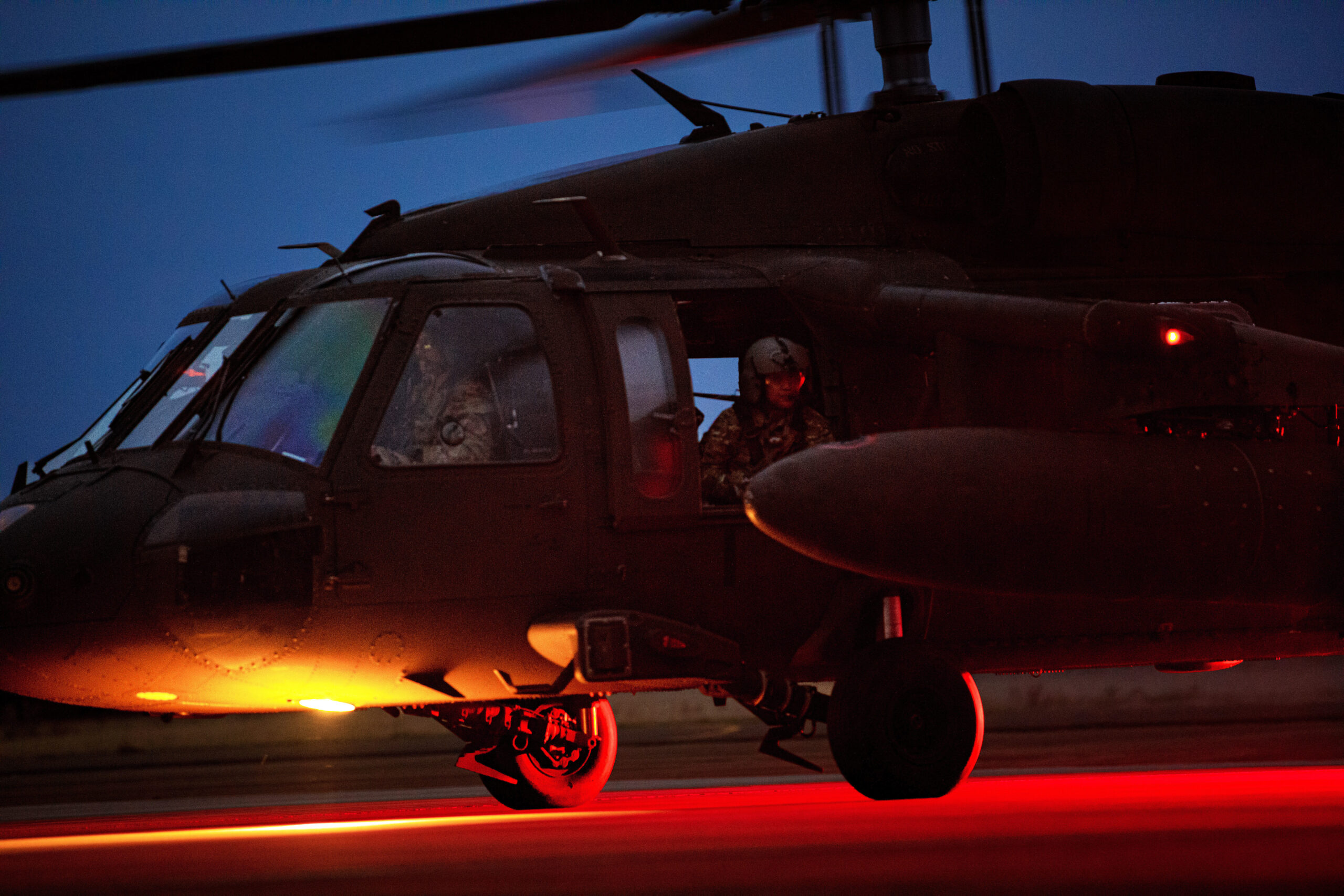 A U.S. Army UH-60 Black Hawk helicopter from 1-214th General Support Aviation Battalion,12th Combat Aviation Brigade, taxis along the flight line after refueling during exercise Falcon Autumn 22 at Vredepeel, Netherlands, Nov. 7, 2022. 12 CAB is among other units assigned to V Corps, America's Forward Deployed Corps in Europe. They work alongside NATO Allies and regional security partners to provide combat-ready forces, execute joint and multinational training exercises, and retain command and control for all rotational and assigned units in the European Theater. (U.S. Army photo by Staff Sgt. Thomas Mort.)