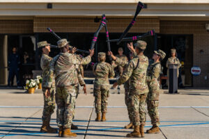 Airmen assigned to the 335th Training Squadron participate in a freestyle drill during the 4th Quarter Drill Down at Keesler Air Force Base, Miss., Oct. 11, 2024. Drill Downs are hosted quarterly by the 81st Training Group to allow Airmen and other service members to train and demonstrate proficiency in executing drill movements. (U.S. Air Force photo by Andrew Young.)