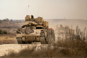 U.S. Army Soldiers assigned to 1st Battalion, 12th Cavalry Regiment, 3rd Armored Brigade Combat Team, 1st Cavalry Division, conduct a training exercise with M3A2 Cavalry Fighting Vehicles, during a combined arms live fire exercise at Jack Mountain range on Fort Cavazos, Texas, Jan. 14, 2025. The CALFEX incorporates indirect fires, aerial, and sustainment assets to simulate realistic combat training to validate a unit's lethality as well as their readiness to deploy. (U.S. Army photo by Spc. Josefina Garcia.)