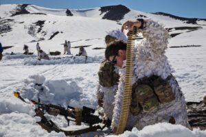 U.S. Army corporals, infantrymen with the 3rd Brigade Combat Team, 10th Mountain Division, load an M249 squad automatic weapon during Exercise Southern Vanguard 25, in Antuco, Chile, Aug. 26, 2025. Exercise Southern Vanguard 25 underscores the U.S. Army’s enduring commitment to regional partnership as U.S. forces deploy to Chile to conduct combined mountain warfare, field, and command post training alongside Chilean forces, with participation from Argentina and Peru - strengthening interoperability, shared readiness, and mutual trust while advancing regional security and cooperation across the Western Hemisphere. (U.S. Army National Guard photo by Sgt. Richelle Cruickshank.)