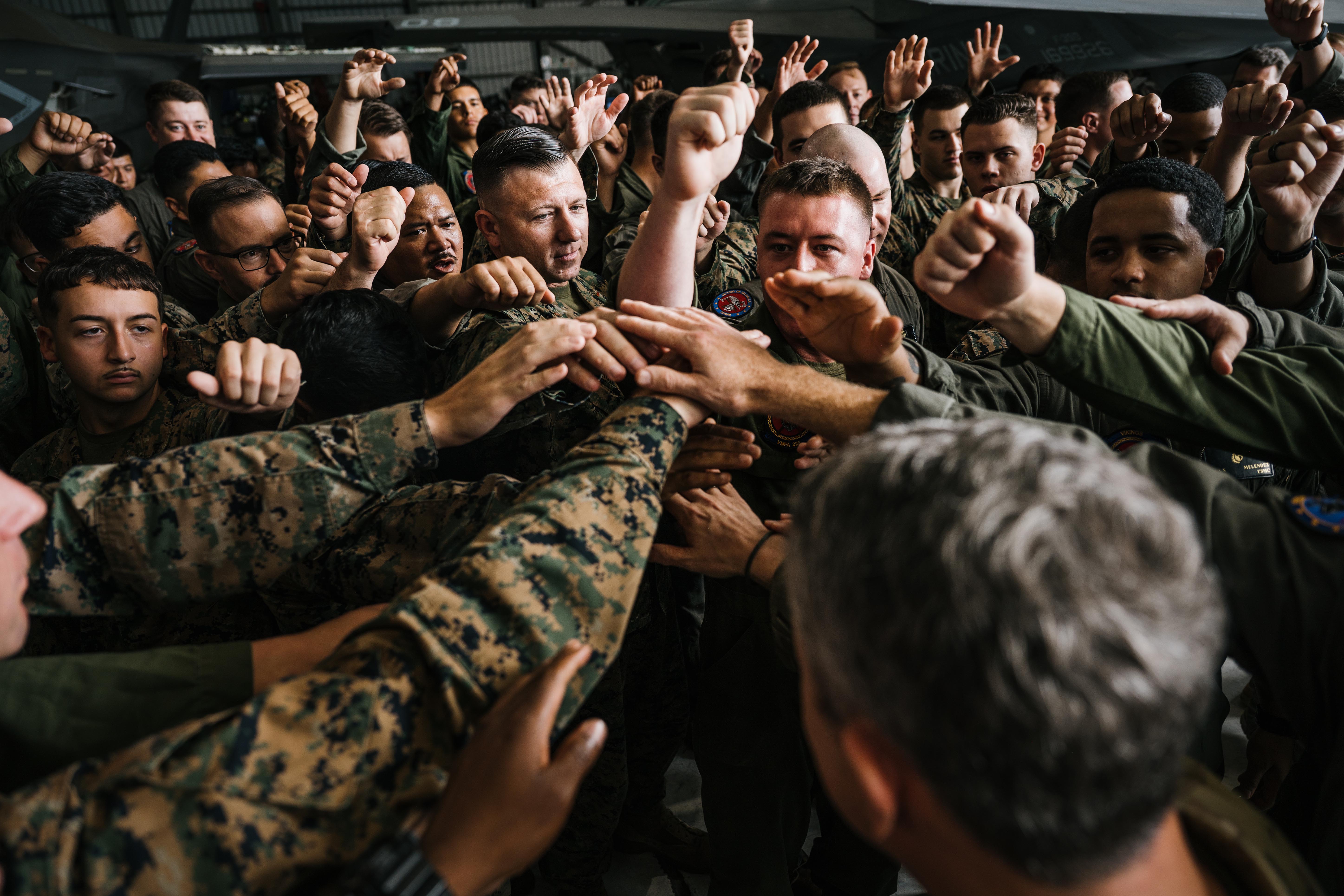 Chairman of the Joint Chiefs of Staff Gen. Dan Caine joins U.S. Marines assigned to the Marine Fighter Attack Squadron (VMFA) 225 for a morale cry during a troop engagement in Ceiba, Puerto Rico, Nov. 24, 2025. U.S. military forces are deployed to the Caribbean in support of the U.S. Southern Command mission, Department of War-directed operations, and the president’s priorities to disrupt illicit drug trafficking and protect the homeland. (U.S. Air Force photo.)