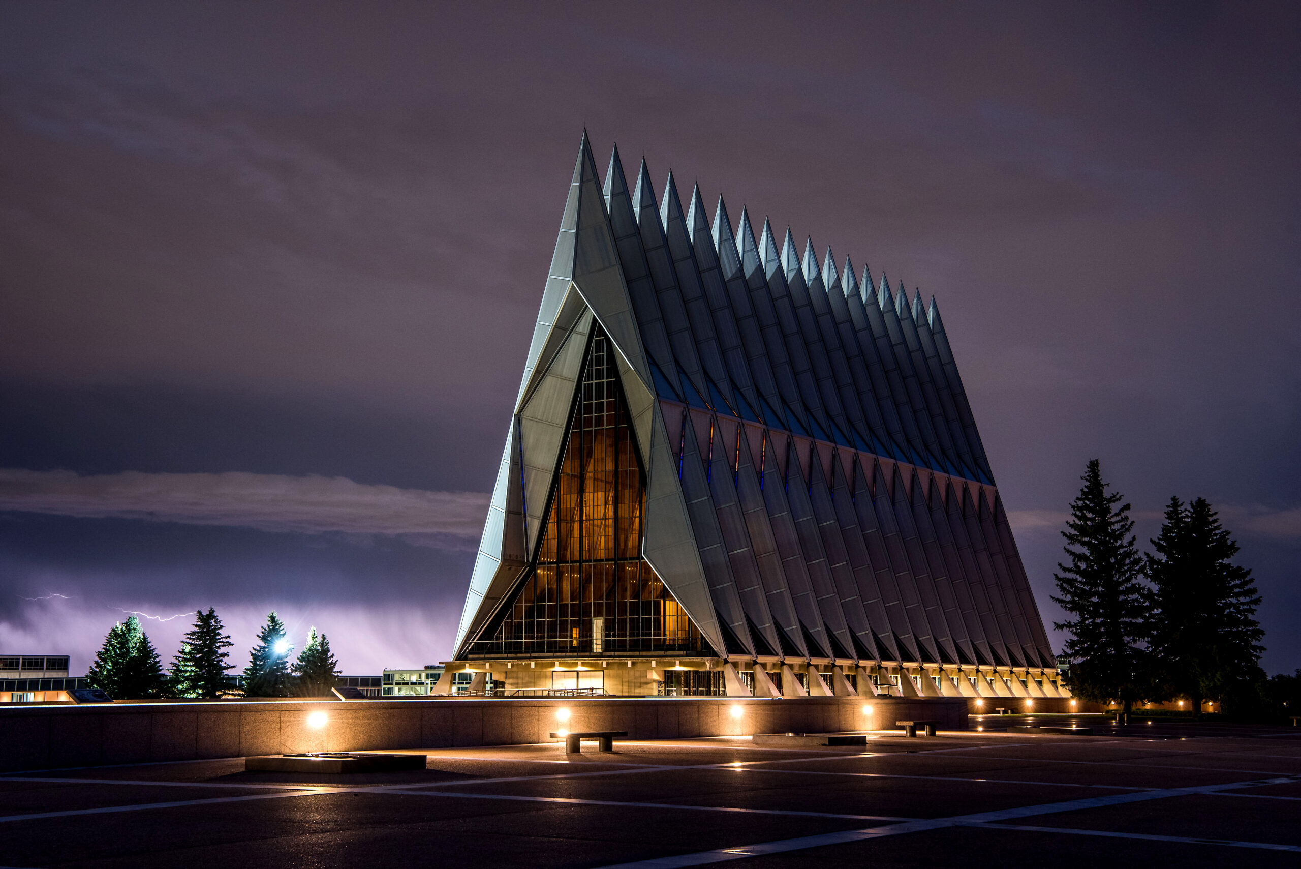 U.S. AIR FORCE ACADEMY, Colo. -- A late evening thunderstorm lights up the sky behind the Cadet Chapel on Jul. 5, 2019. (U.S. Air Force photo by Trevor Cokley.)