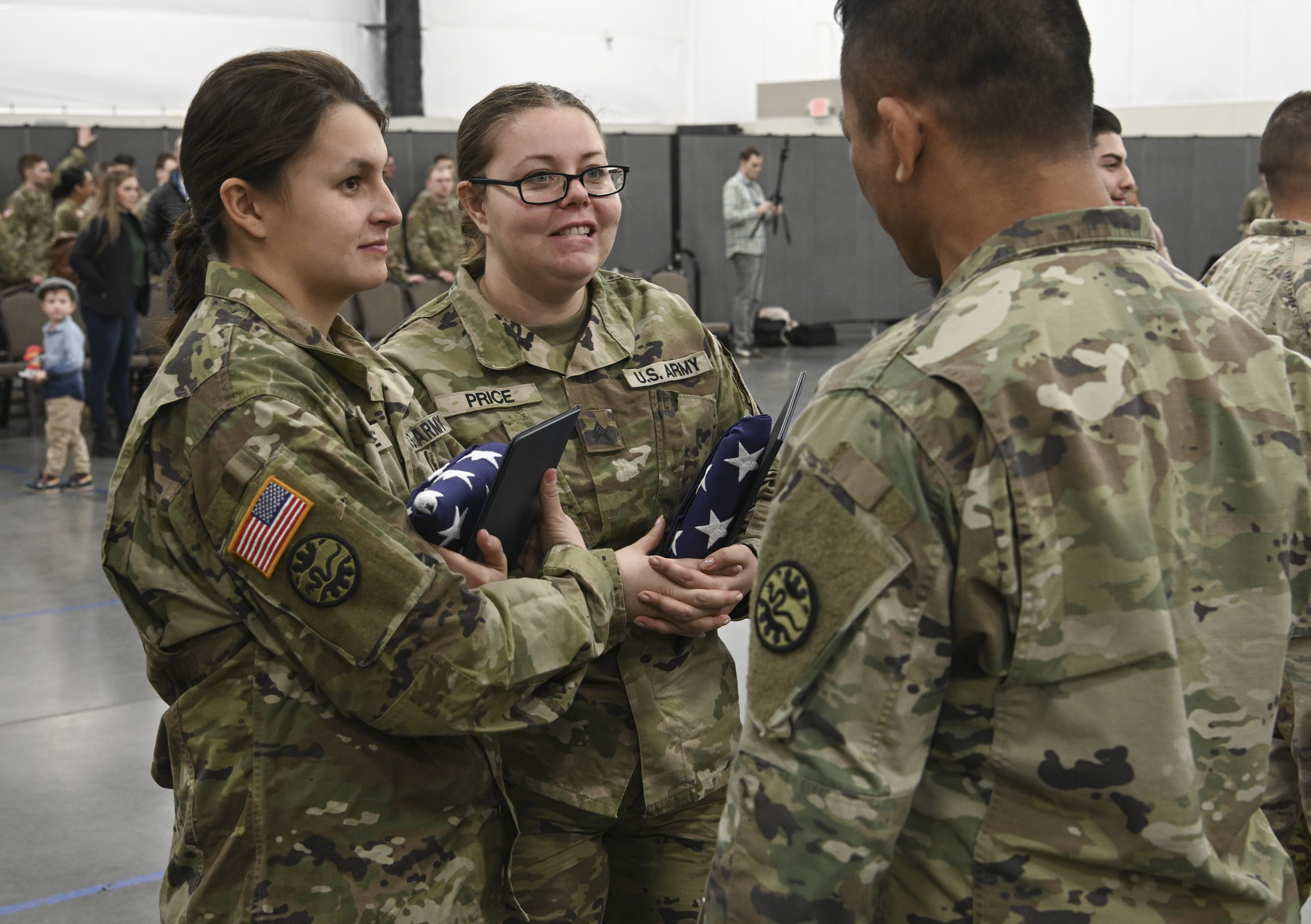 Oregon Army National Guard Soldiers assigned to Bravo Company, 3rd Battalion, 116th Cavalry, spend time talking and catching up with each other after their formal demobilization ceremony on March 5, 2023 in Hermiston, Oregon. The unit members were deployed for nearly a year to support Operation Spartan Shield, strengthening defensive relationships, and building partner nation’s abilities in the Middle East. (National Guard photo by John Hughel, Oregon Military Department Public Affairs.)