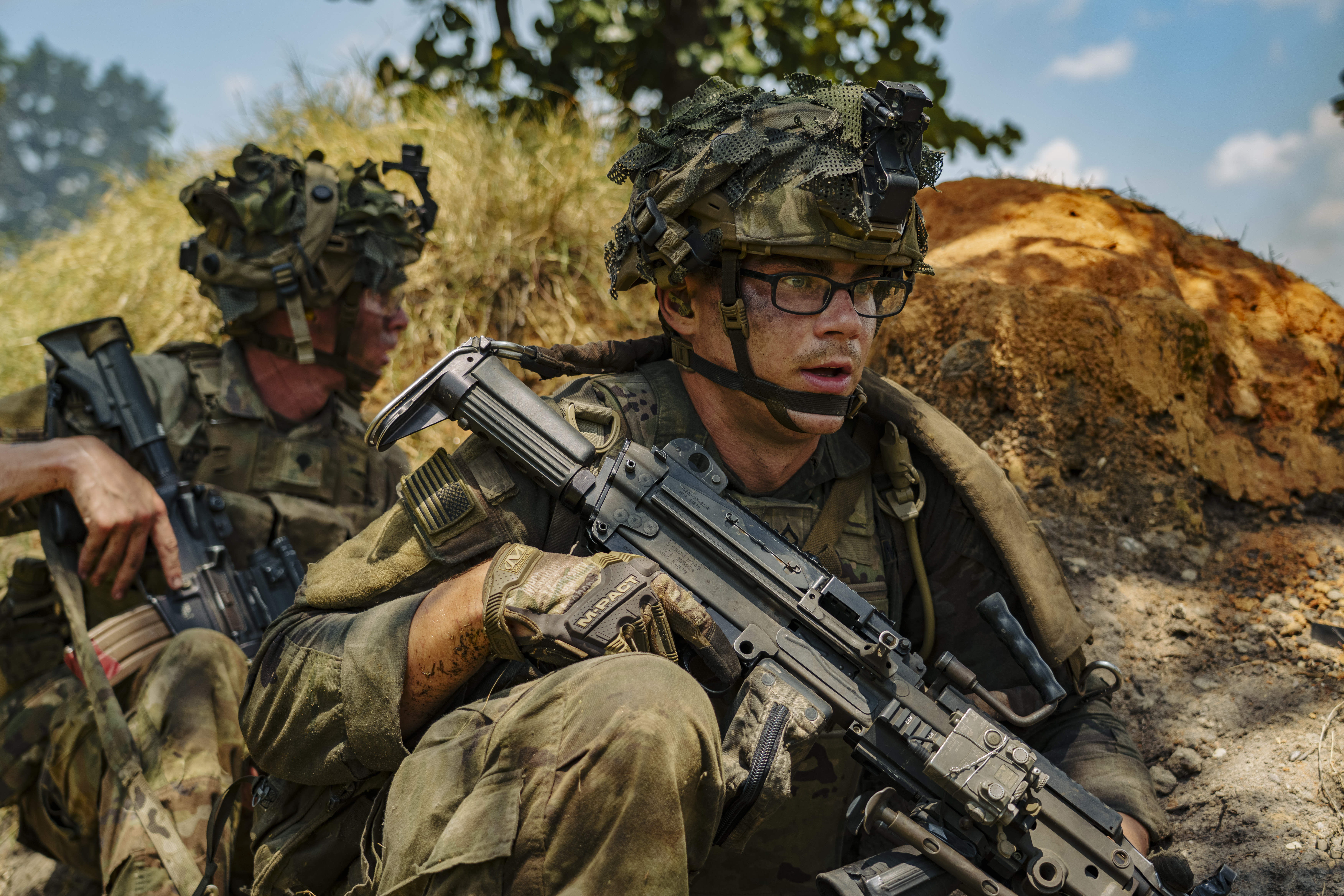 A Paratrooper assigned to 2nd Battalion, 504th Parachute Infantry Regiment “White Devils,” 1st Brigade Combat Team, 82nd Airborne Division uses cover with his team at a live-fire exercise during Devil Avalanche, at Fort Bragg, North Carolina, July 27, 2025. White Devils conduct live-fire exercises to build trust and cohesion, challenging Paratroopers to depend on each other’s skills and decision making under pressure while sharpening their readiness to deploy and respond anywhere in the world within 18 hours. (U.S. Army photo by Spc. Aiden O’Marra.)