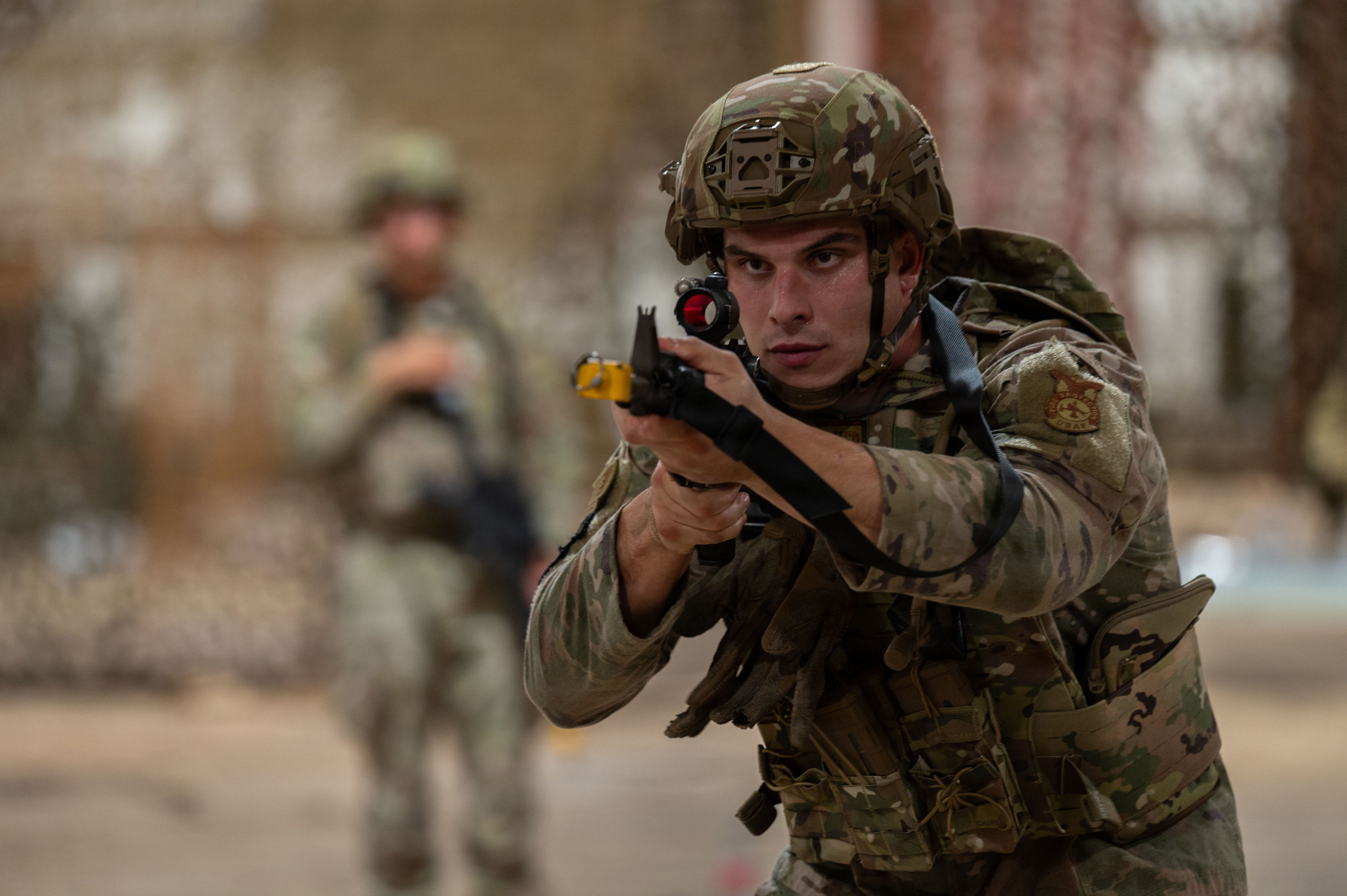 U.S. Air Force Senior Airman, 21st Combat Air Base Squadron firefighter, practices shooting stances as part of Close Quarters Battle training during Joint Pacific Multinational Readiness Center 26-01 at Schofield Barracks, Hawaii, Nov. 6, 2025. These training events prepare the 21st CABS to operate in contested environments, increasing combat survivability and lethality, and enhancing readiness for worldwide missions. (U.S. Air Force photo by Senior Airman Alondra Cristobal Hernandez.)