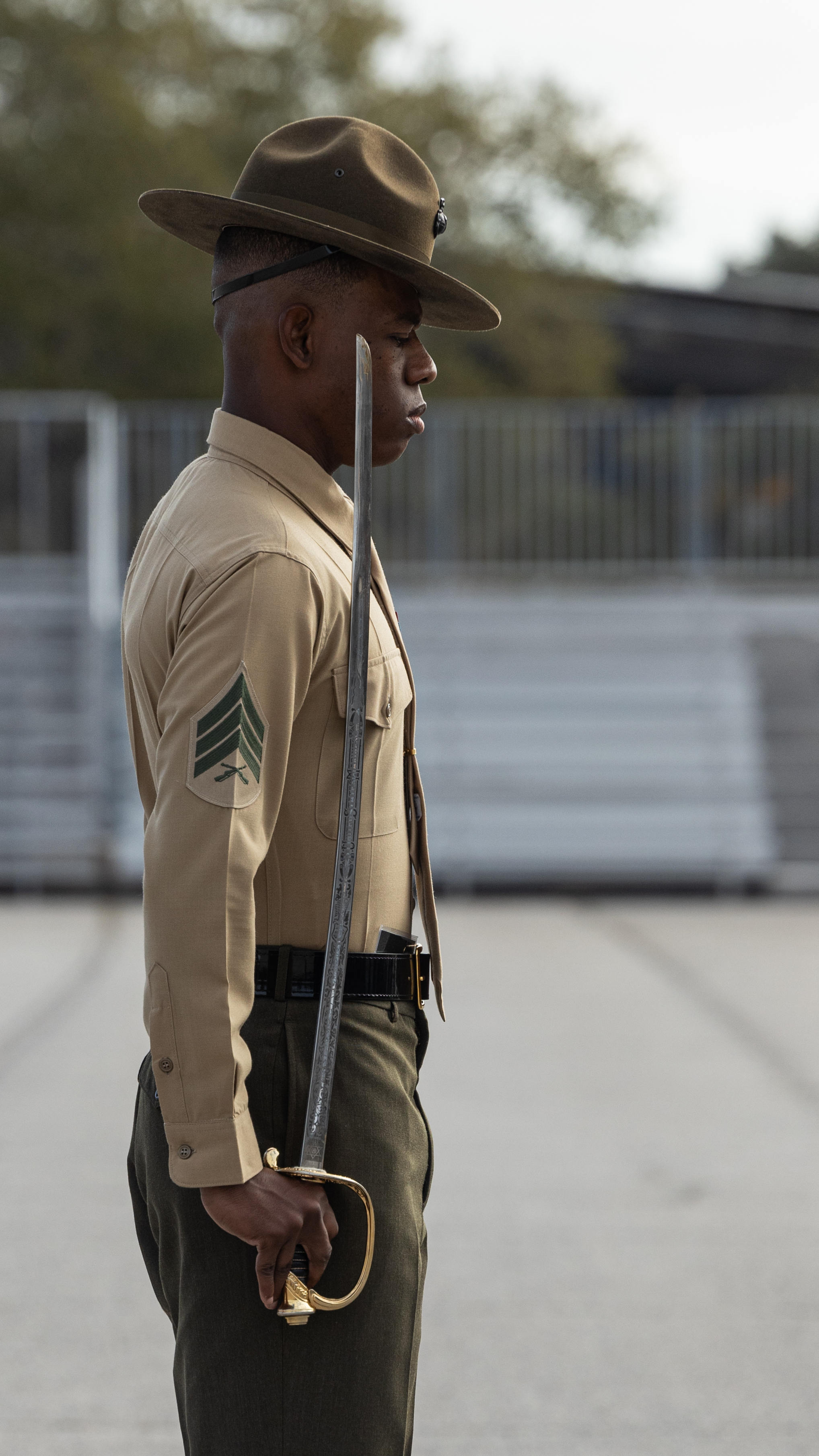 U.S. Marine Corps drill instructor with Echo Company, 2nd Recruit Training Battalion, marches his platoon during the initial drill inspection on Marine Corps Recruit Depot Parris Island, S.C., Jan. 5, 2026. Initial Drill is the first marker of the recruits' discipline and unit cohesion. (U.S. Marine Corps photo by Cpl. Jordy Morales.)