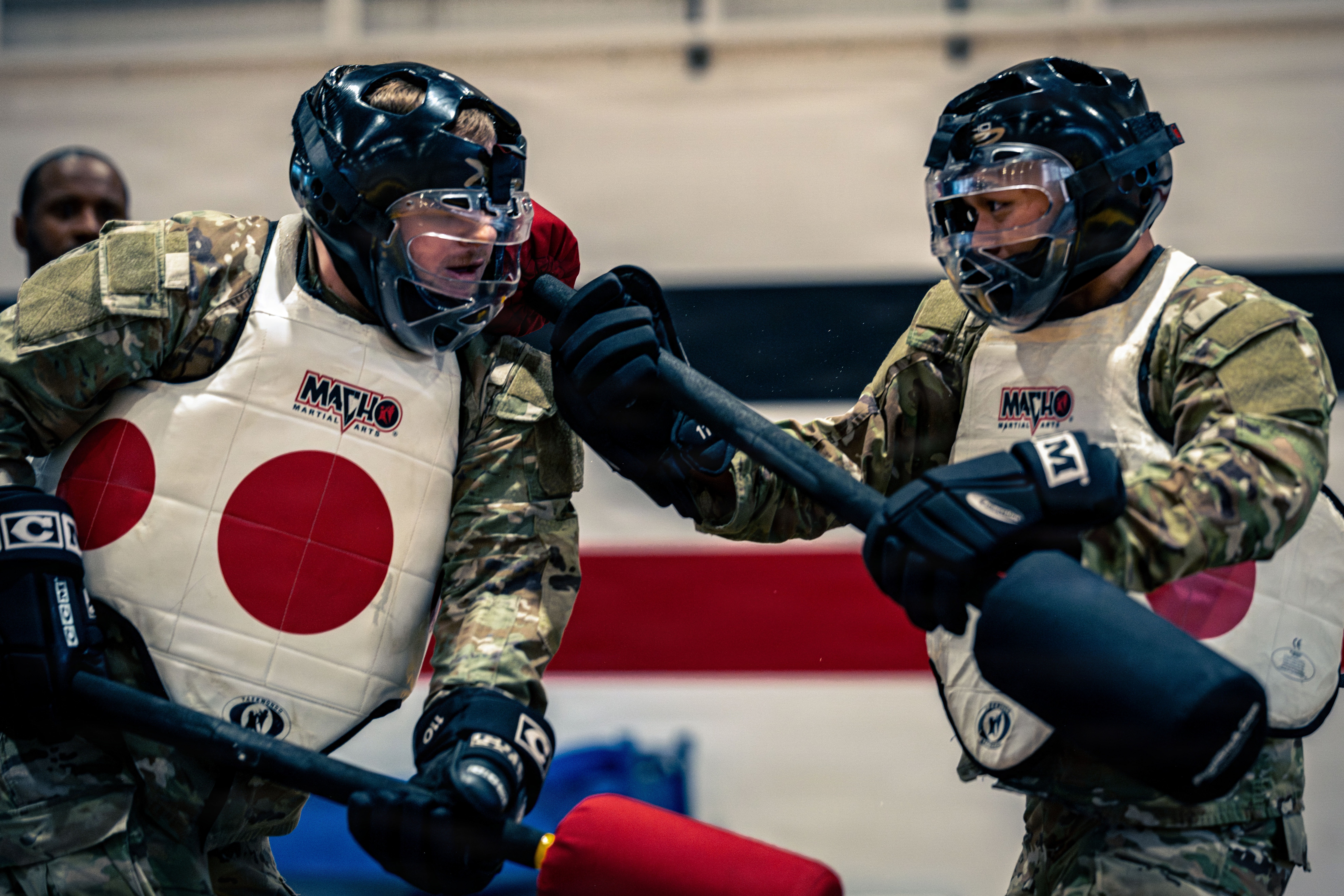 U.S. Army soldiers assigned to Headquarters & Headquarters Battery, 52D Air Defense Artillery Brigade, 10th Army Air & And Missile Defense Command, participate in a pugil stick match during a battery physical training session in Sembach Kaserne, Germany, May 8, 2026. The event was designed to build confidence, mental resilience and the ability to perform under physical and cognitive stress. (U.S. Army photo by Sgt. Luis Garcia.)