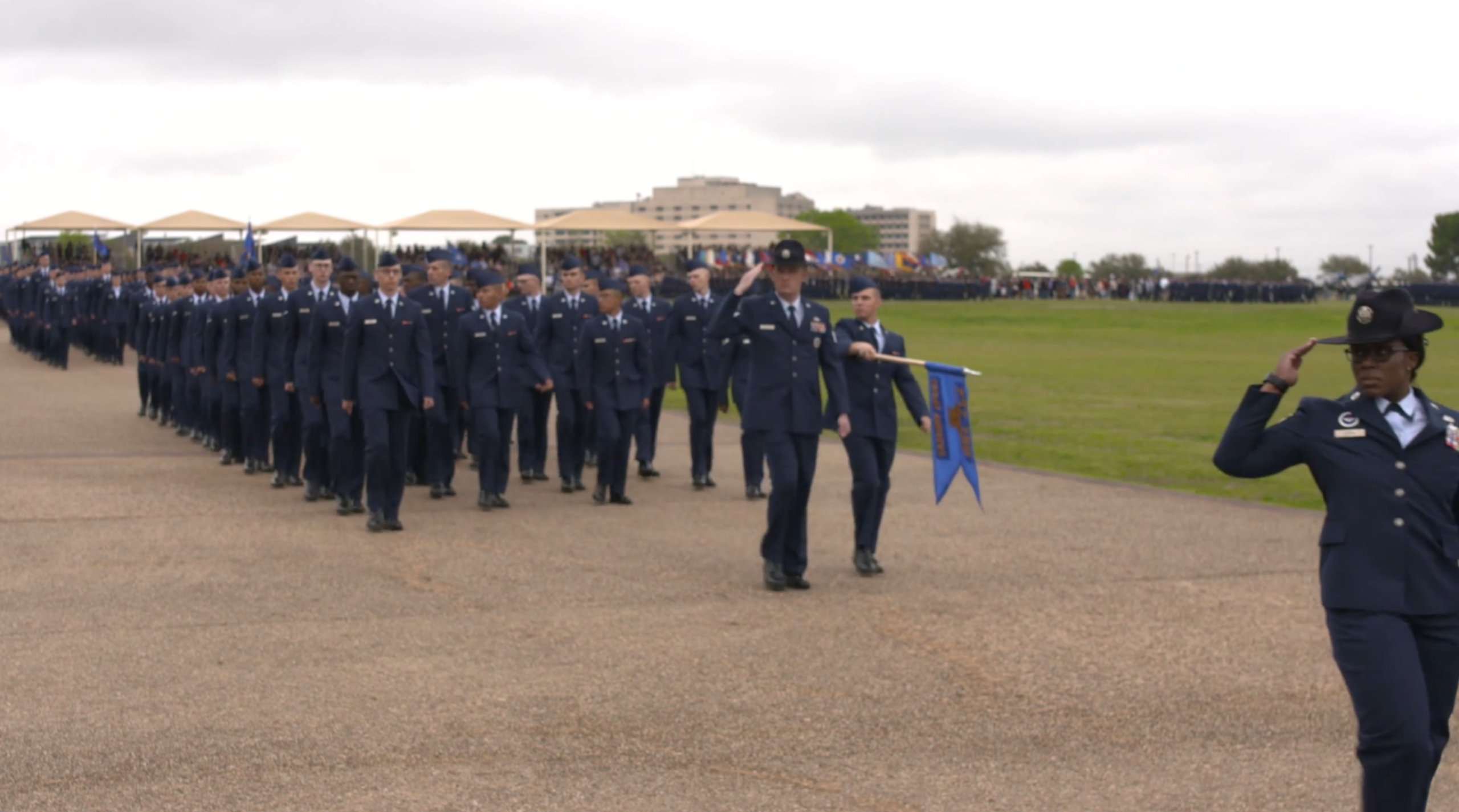 Two shots of the Basic Military Training parade specifically captured for time lapse purposes or establishing marching footage. (Video by Todd Holly.)