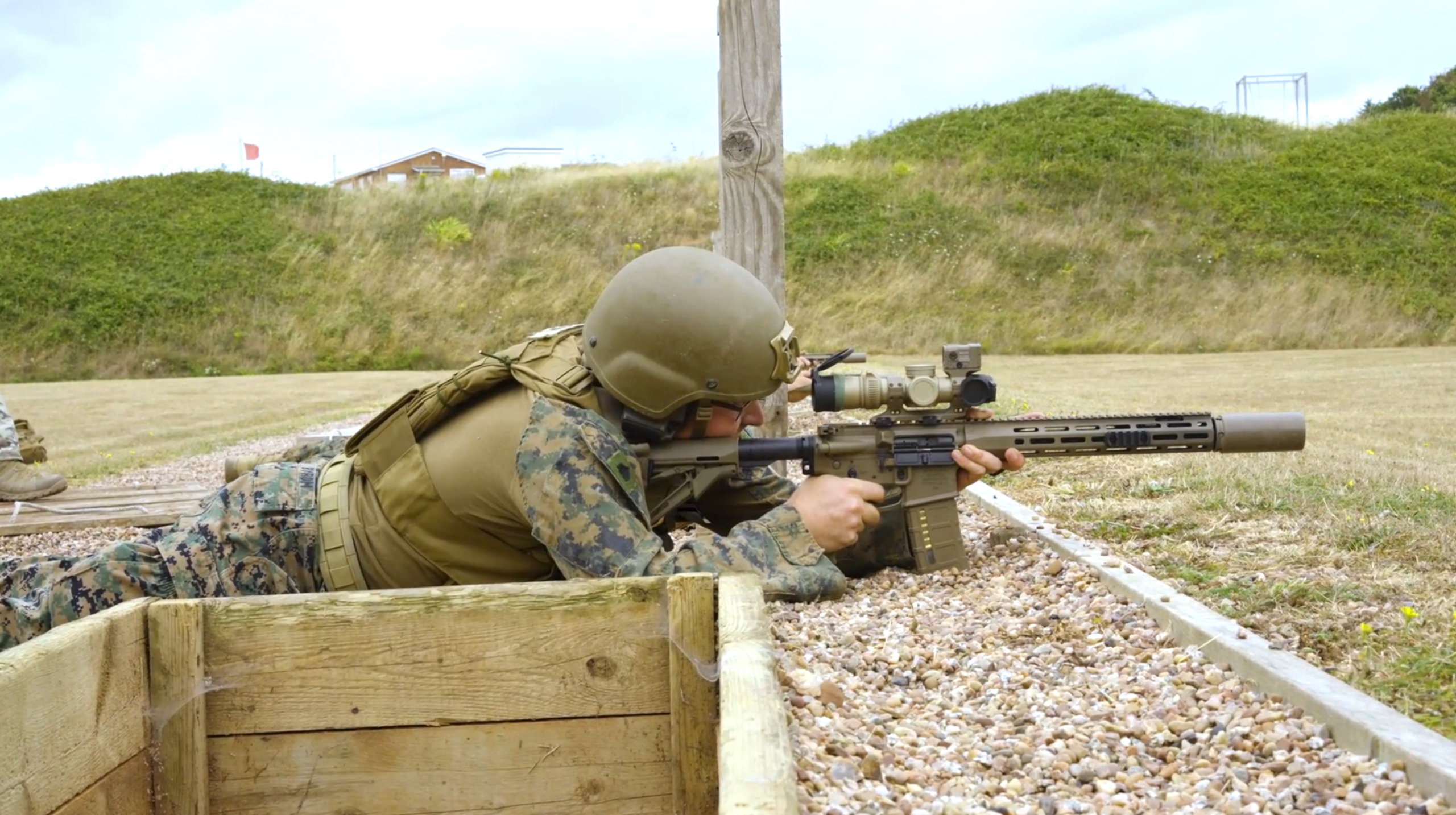 U.S. Marines with the Marine Corps Shooting Team, Weapons Training Battalion-Quantico, Training Command, Training and Education Command, complete the rifle and pistol qualification at the Commando Training Centre Royal Marines in Lympstone, Devon, England, July 15, 2025. Marines with the MCST qualified on the range in preparation for a competition match. (U.S. Marine Corps video by Cpl. Memphis Pitts.)
